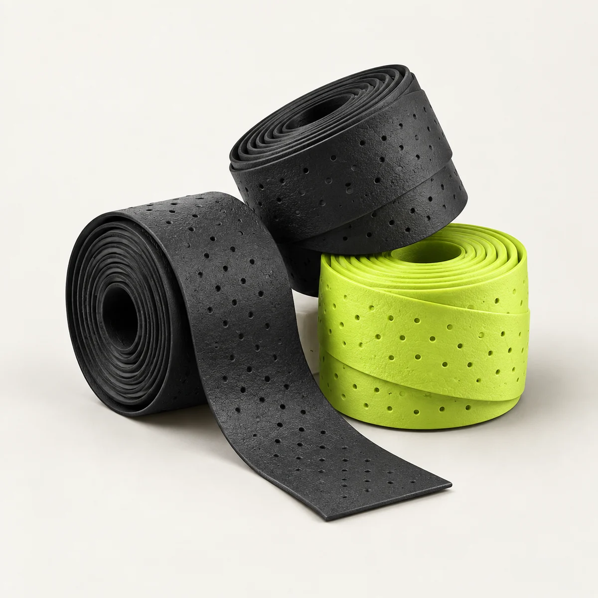 Concept rendering of black and lime rolled paddle overgrips; colours and pack quantity are not final.